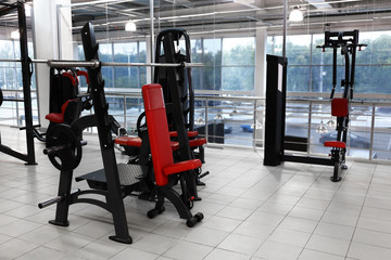 Fototapeta na wymiar Weight lifting machines in gym