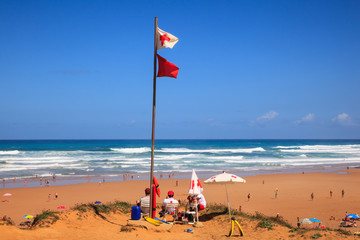 Lifeguards sitting on surveillance post