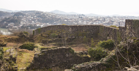 Fototapeta na wymiar the ruins of an ancient fortress on a background of Kutaisi, Georgia