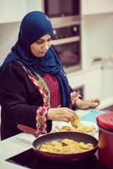 Beautiful asian muslim woman smile while looking to the camera i