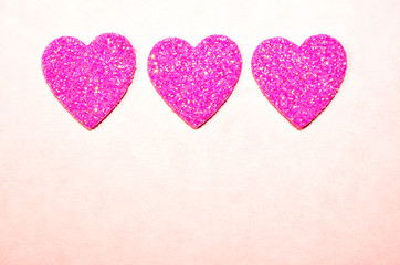 Sparkle, twinkle, glitter of romantic pink hearts.  Symbol of romance for Valentine's Day, Wedding, Anniversary, Love.