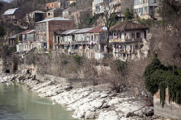 Fototapeta na wymiar Rioni River in cloudless weather, Kutaisi, Georgia