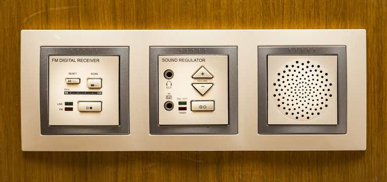 modern FM digital radio receiver on a wooden wall