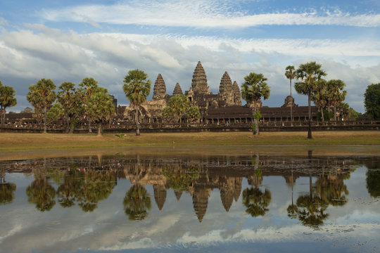 Classic view of Angkor Wat temple reflecting in the pond lake 