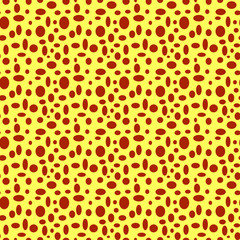 Seamless yellow pattern with brown polka dots in different sizes as a background - Eps10 vector graphics and illustration