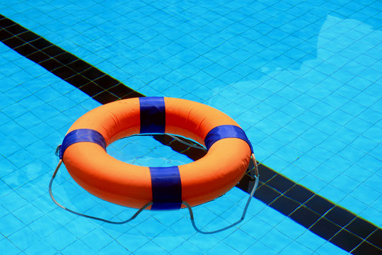 swimming pool with floatable toys in the water