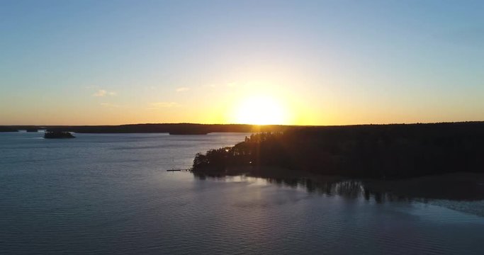 Cinema 4k aerial flight above koivuniemi or bj&ouml;rkudden, , at a sunset in the finnish archipelago of Inkoo, in Finland