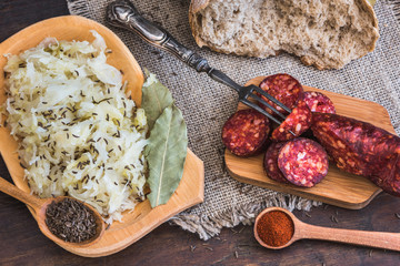 Farmer's Breakfast. Sausage, Sour Cabbage and Bread. Raw Ingredients and Seasoning.