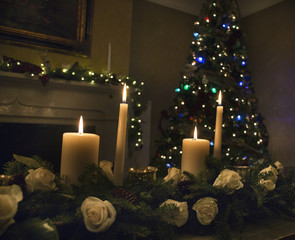 Christmas table floral arrangement with candles and Christmas tree