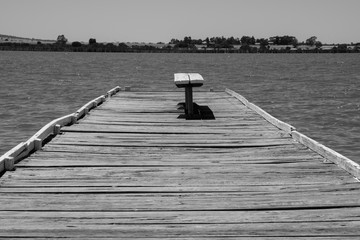 Wooden pier with bench seat low angle - 133356311