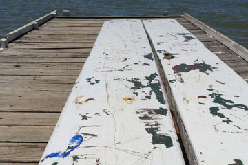 Vandalism on pier bench - 133356337
