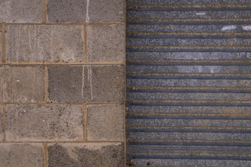 Brick wall with metal roller door