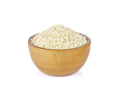 white sesame in wooden bowl on white background