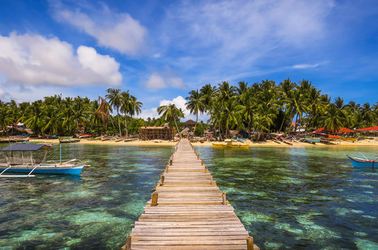 Wooden Dock and Fishing Village Landscape With Tide Pools and Palm Trees - Siargao Island, Mindanao - Philippines