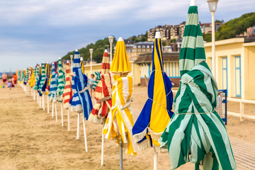 Beach umbrellas in Trouville - obrazy, fototapety, plakaty
