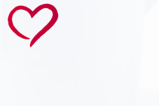 horizontal image of a red outlined heart in the top left corner a blank image with pure white background great for text.