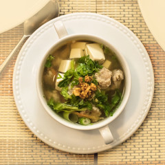Thai soup with meatballs, vegetables, tofu, and soy noodles
