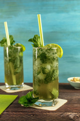 Mojito cocktail with mint leaves and lime