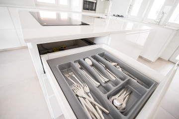 Opening drawer for Silver cutlery, focus on kitchenware..