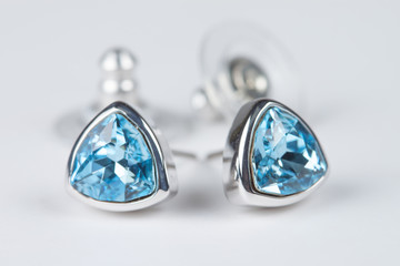 Elegant embedded aquamarine earrings isolated on white backgroun