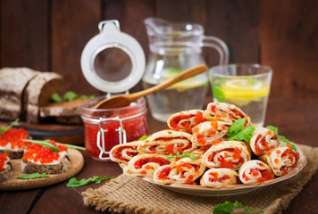 Pancakes with red caviar on plate. Russian cuisine. Maslenitsa