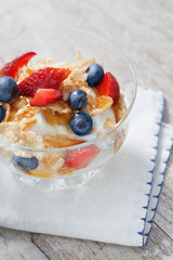 close up view of nice fresh yummy parfait on color back