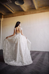 Fototapeta premium Bride in wedding dress at luxurious studies