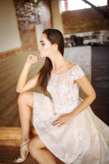 Naklejka premium Bride in wedding dress at luxurious studies