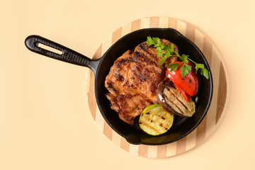 Fried meat with vegetables in a pan