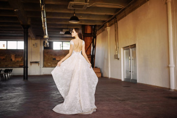 Obraz na płótnie Canvas Bride in wedding dress at luxurious studies