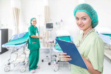 Nurse writing a medical record in the hospital room