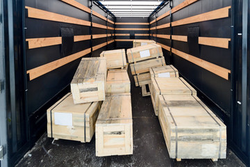 Pile of wooden crates inside the cargo semitrailer.