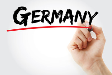 Hand writing Germany with marker, concept background