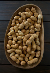peanuts on wooden surface
