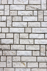 White bricks in layers as a cladding of a wall