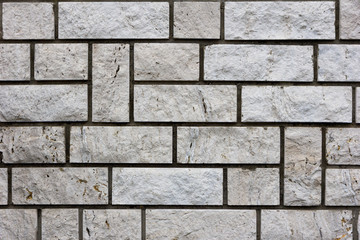 White bricks in layers as a cladding of a wall