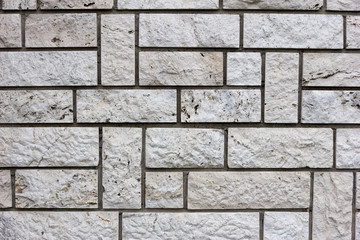 White bricks in layers as a cladding of a wall