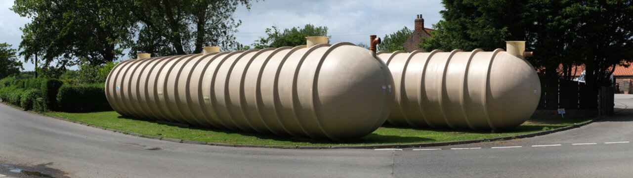 Large cess tanks ready to be buried underground for sewage collection and disposal.