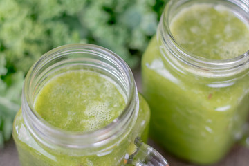 Nutritional smoothie of fresh organic curly green kale with tang