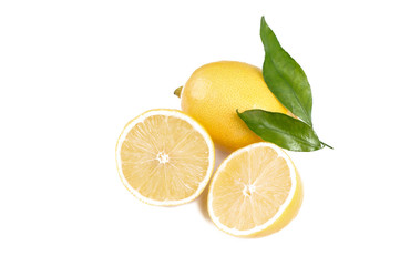 Lemon with leaves . Fruit and half isolated on white background.