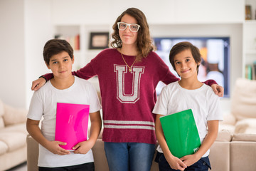 Happy kids at home with books
