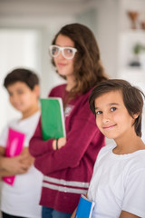 Happy kids at home with books