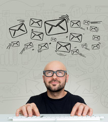 View of a Young attractive bold man geek with glasses thiniking about messages