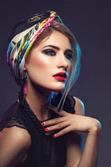 Beautiful girl with bright make-up and shawl on head