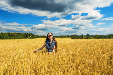 Beautiful woman in wheat field