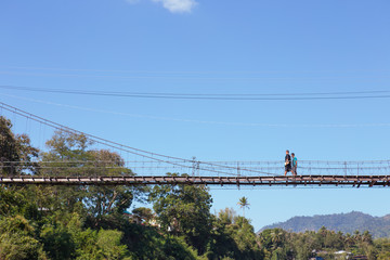 man walking on the bridge