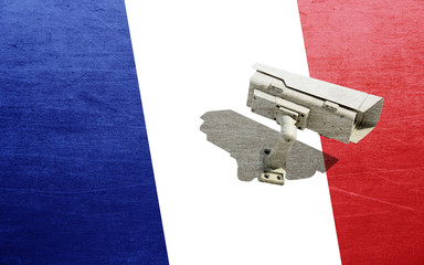 Surveillance camera on background of France flag