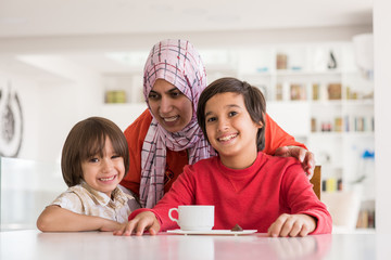 Happy muslim family at new modern home