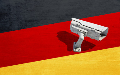 Surveillance camera on background of flag Germany