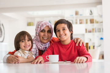 Happy mother and son at modern new white home